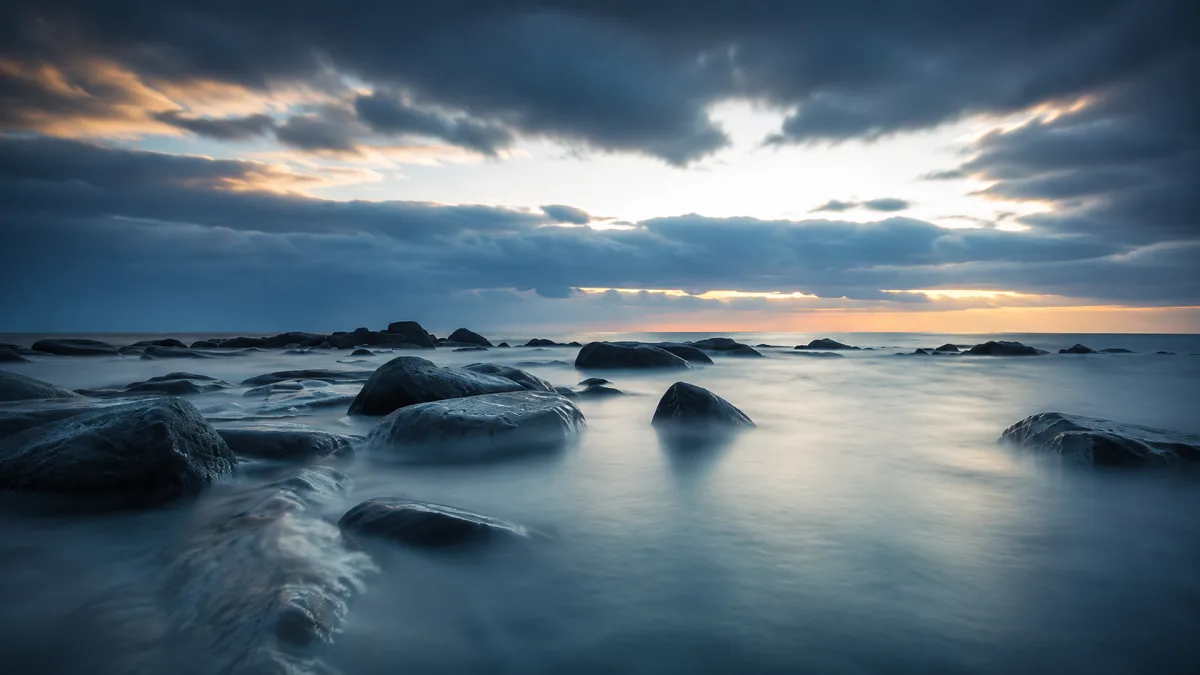 A dramatic stormy ocean horizon suggests coastal energy, waves, wind, and changing weather.