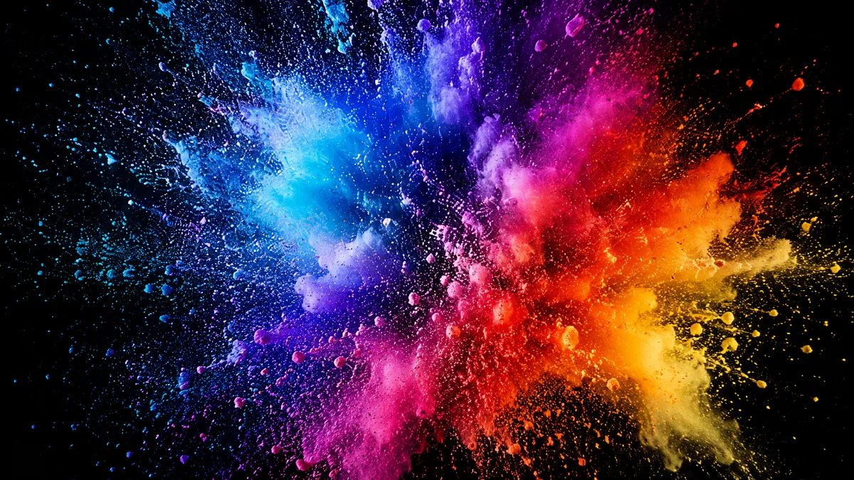 colorful powder burst exploding against a dark background